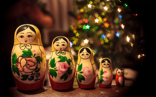 HD desktop wallpaper featuring a set of handcrafted nesting dolls with floral designs, illuminated by colorful star-shaped bokeh lights in the background.