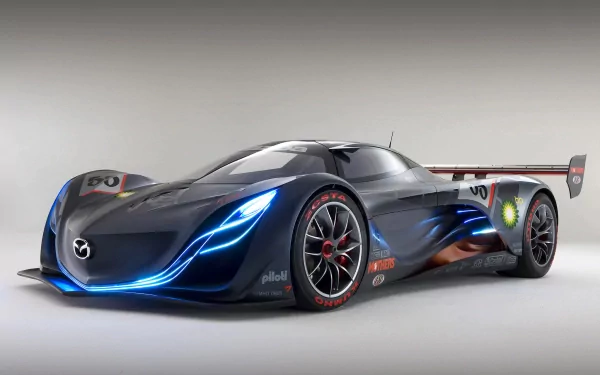 HD desktop wallpaper featuring a sleek Mazda Furai sports car with glowing blue accents and aerodynamic design, showcasing its futuristic vehicle styling.