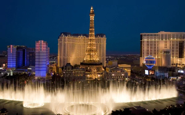 HD PC desktop wallpaper showcasing the illuminated Las Vegas Strip at night, featuring the Eiffel Tower replica and vibrant water fountains in a stunning man-made cityscape.
