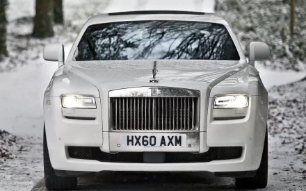 Front view of a white Rolls-Royce vehicle on a snowy road — HD PC desktop wallpaper/background.