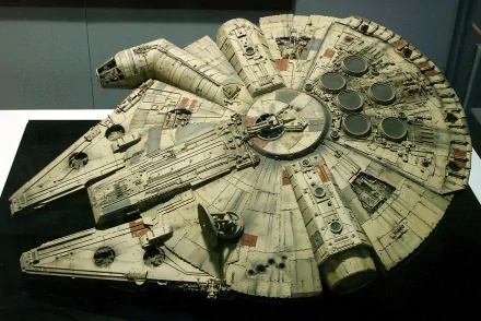 Detailed HD desktop wallpaper featuring the iconic Millennium Falcon from Star Wars, capturing its sci-fi design and intricate mechanical details.