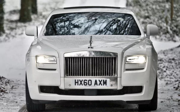 Front view of a white Rolls-Royce vehicle on a snowy road — HD PC desktop wallpaper/background.
