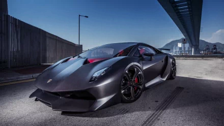 A striking Lamborghini Sesto Elemento parked under a sleek overpass, showcasing its sharp design and matte finish. This HD image serves as an impressive desktop wallpaper.