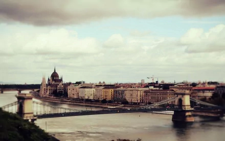 A stunning HD desktop wallpaper featuring the historic Chain Bridge over the Danube River in Budapest, Hungary, showcasing iconic man-made architecture.