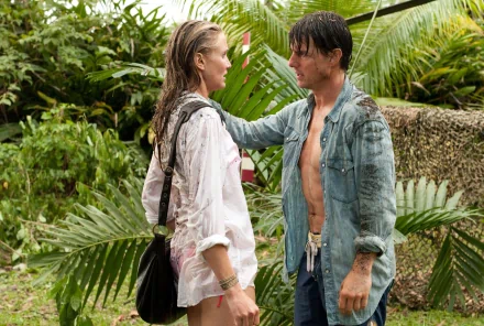 Tom Cruise and Cameron Diaz in a scene from the movie Knight and Day, set in a lush, tropical environment, showcasing their on-screen chemistry and adventure.