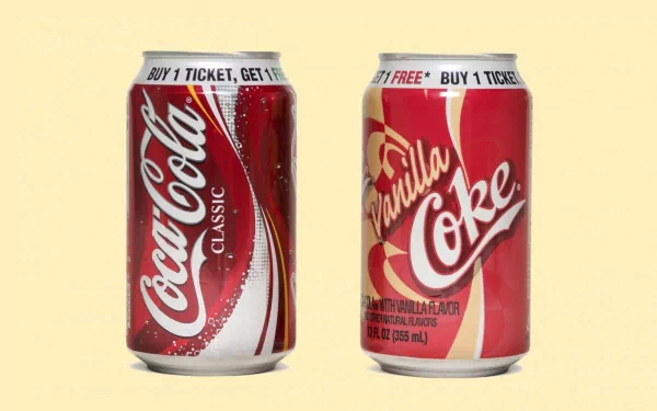 Man-made Coca-Cola image: two cans (Classic and Vanilla Coke) on a pale backdrop, presented as a 2K Quad HD PC desktop wallpaper/background.