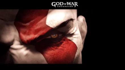Close-up of Kratos' intense eye with red war paint, from the video game God of War: Ascension, featured in a HD PC desktop wallpaper background.
