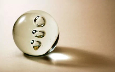 HD PC desktop wallpaper featuring an abstract transparent sphere with smaller bubbles inside, set against a soft beige background.