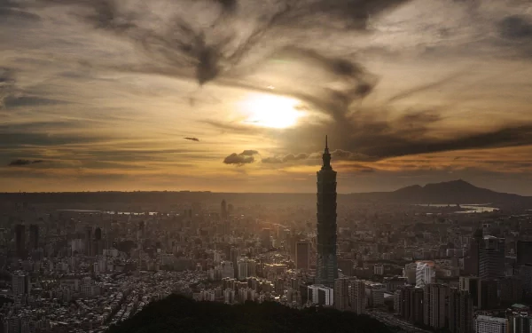 Taipei skyline at sunset with Taipei 101 towering over Taiwan's man-made urban sprawl — HD PC desktop wallpaper and background.