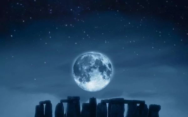 A stunning HD wallpaper featuring Stonehenge silhouetted against a full moon and starry sky, highlighting the intricate interplay of light and shadow in a serene, mystical setting.