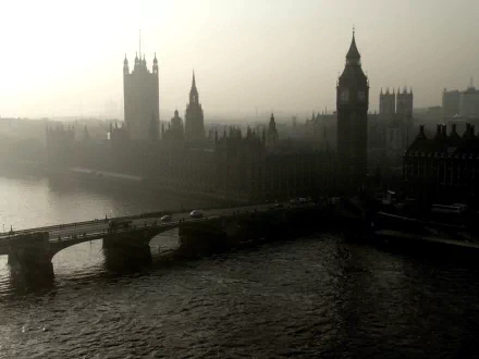 HD desktop wallpaper featuring a misty view of London with Big Ben and adjacent man-made structures along the river.