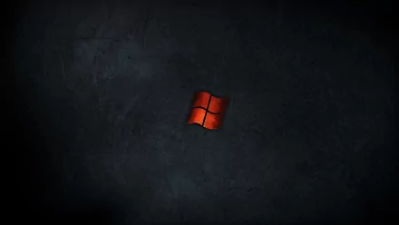 A striking HD desktop wallpaper featuring a red Windows logo set against a dark, textured background, embodying a sleek and modern technology aesthetic.