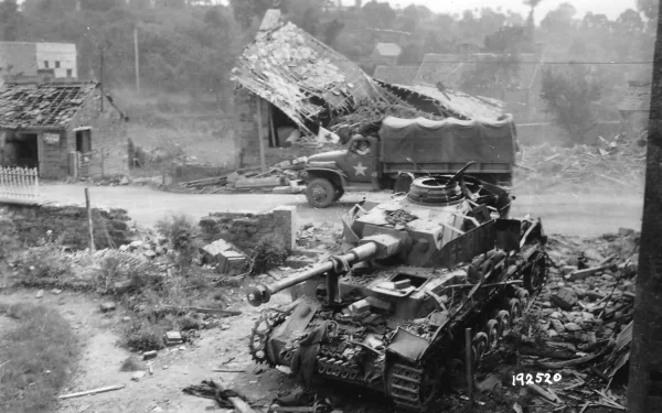 Black and white HD desktop wallpaper featuring a World War II Panzer IV tank in a war-torn village with a military truck in the background.