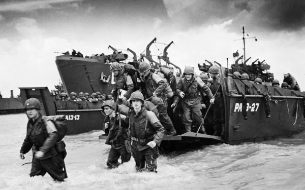 HD desktop wallpaper showing soldiers disembarking from landing crafts during the D-Day military invasion in World War II.