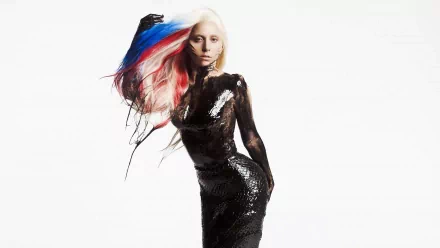 A striking HD desktop wallpaper featuring Lady Gaga, showcasing her iconic style with vibrant hair and a bold outfit, embodying the essence of music and performance.