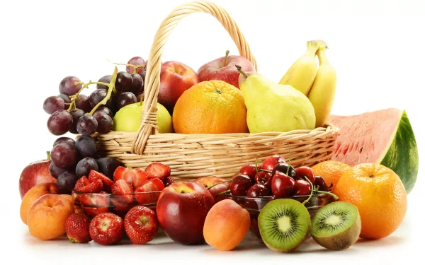 A vibrant assortment of fresh fruits including grapes, bananas, apples, oranges, kiwi, and watermelon arranged in and around a wicker basket, displayed in 4K Ultra HD quality.