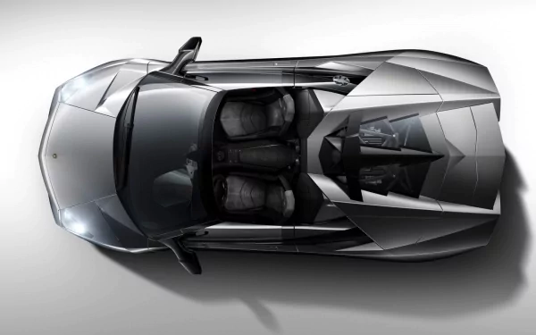 Top-down view of a sleek, silver Lamborghini Reventon, showcasing its sharp lines and detailed interior as an HD PC desktop wallpaper background.