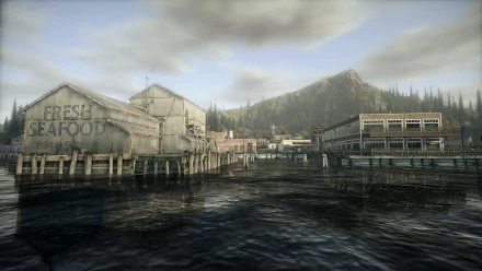 HD desktop wallpaper featuring a serene lakeside view with buildings from the game Alan Wake.