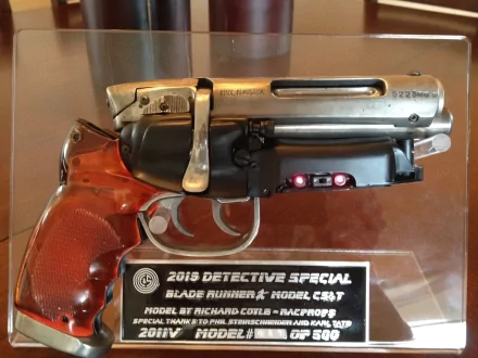 HD PC desktop wallpaper featuring the iconic replica of the 2019 Detective Special blaster from the movie Blade Runner.