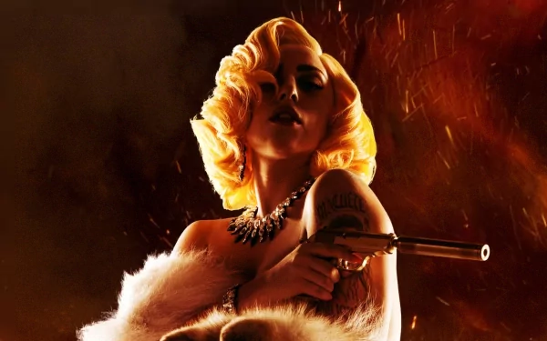A striking HD wallpaper featuring Lady Gaga, exuding confidence and allure with a glamorous hairstyle and a fierce pose, set against a dramatic, fiery background.