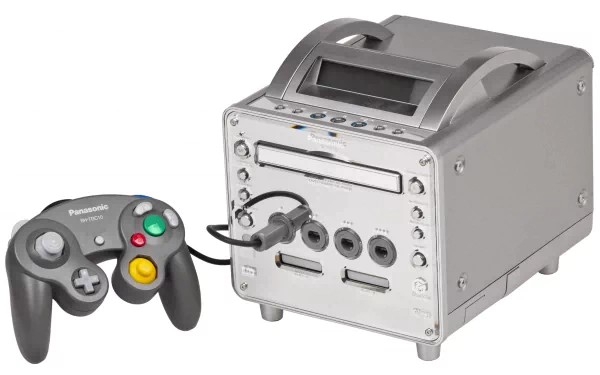 Panasonic Q video game console with wired controller and chrome cube chassis on a white background, presented as a 4K Ultra HD PC desktop wallpaper and background.