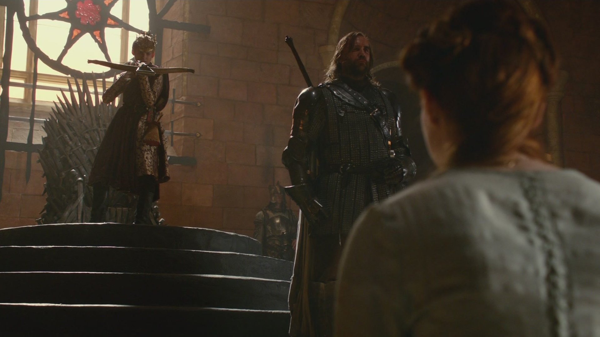 HD Game of Thrones desktop wallpaper featuring Rory McCann as Sandor Clegane and Jack Gleeson as Joffrey Baratheon in a tense throne room scene.