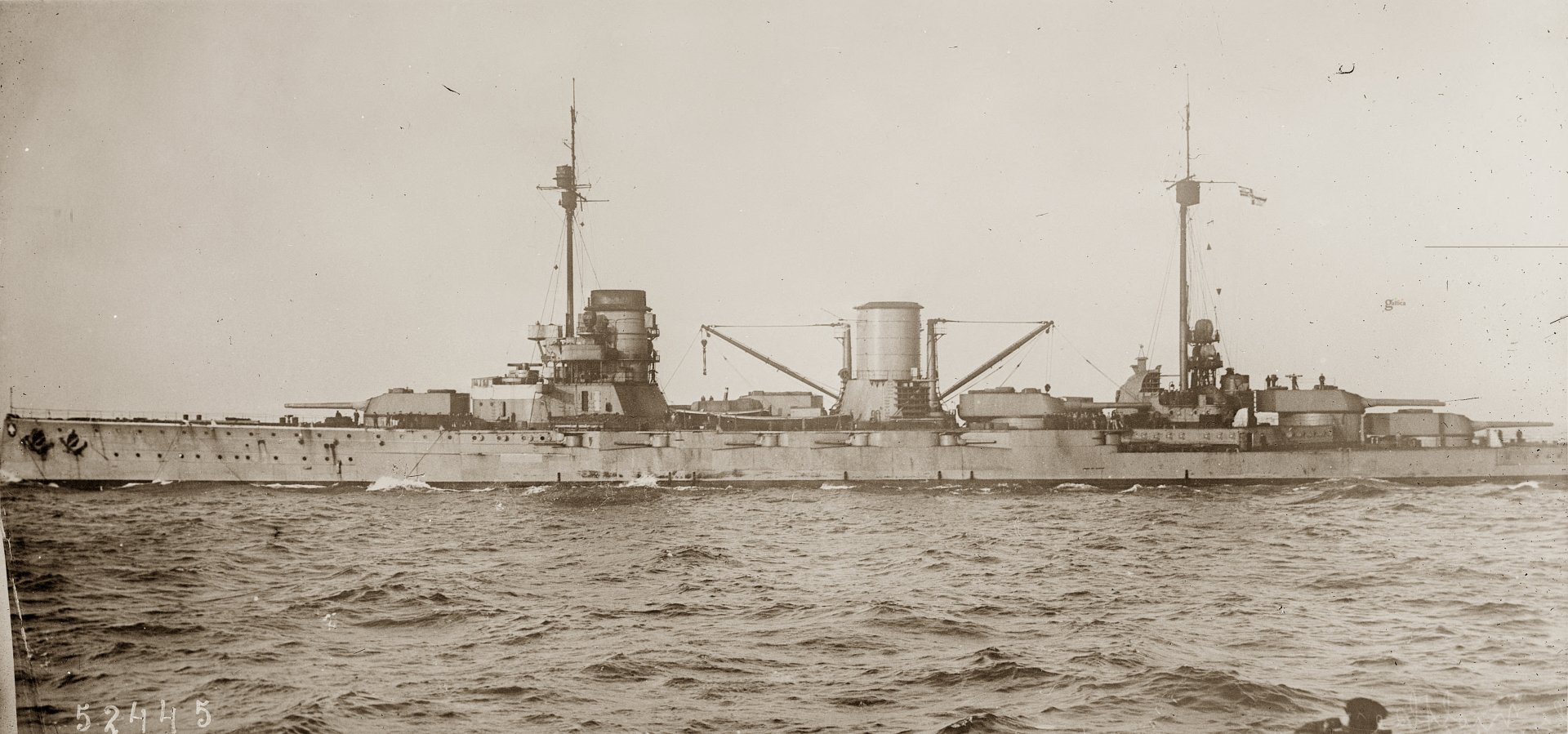 A detailed 4K Ultra HD wallpaper of a vintage military ship sailing on calm waters, showcasing classic naval design and structure.