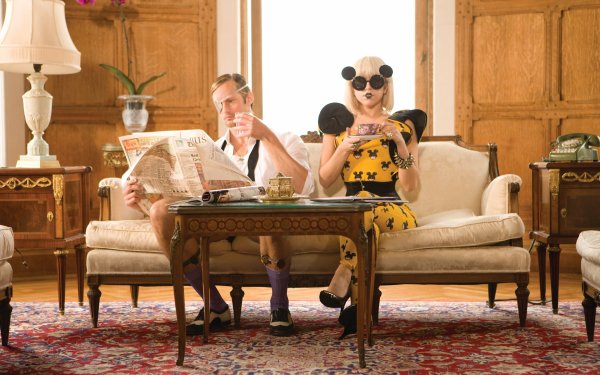 Music Lady Gaga Blonde Table Sofa American Singer Cup Sunglasses Newspaper Socks HD Wallpaper | Background Image