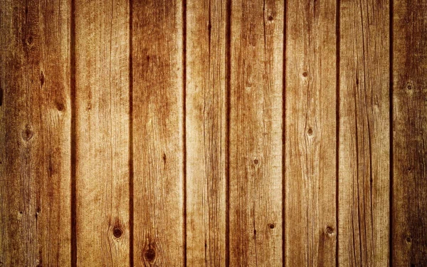A high-definition desktop wallpaper featuring a close-up view of wooden planks, showcasing rich textures and warm tones. The artistic design adds a rustic charm to any screen.
