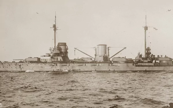 A detailed 4K Ultra HD wallpaper of a vintage military ship sailing on calm waters, showcasing classic naval design and structure.