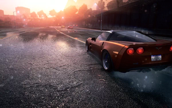 HD wallpaper from Need For Speed: Most Wanted featuring a Corvette in a high-speed chase at sunset.