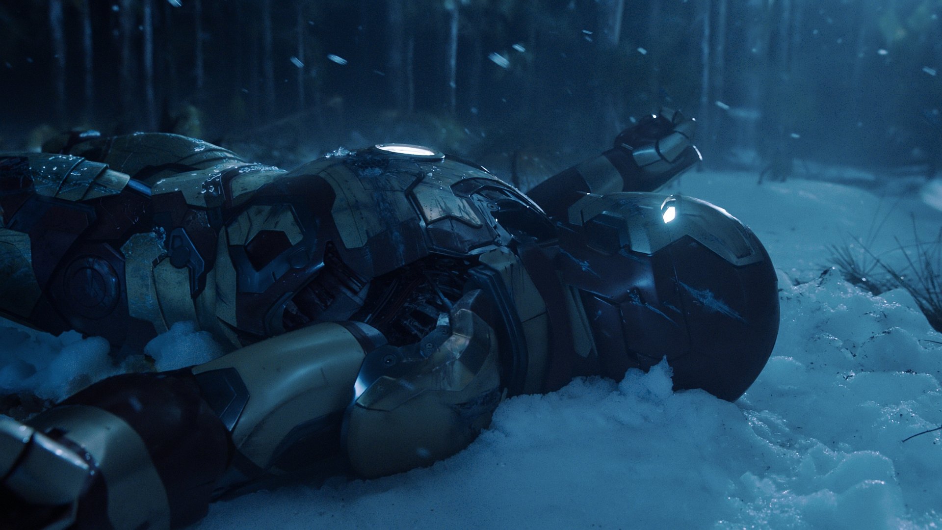 HD PC desktop wallpaper featuring Iron Man in his armor lying in the snow from the movie Iron Man 3.