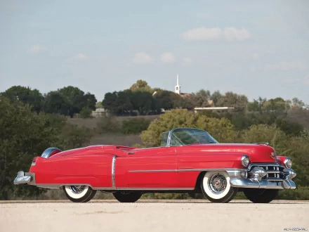 Red 1953 Cadillac Eldorado convertible parked outdoors, showcased as an HD PC desktop wallpaper and background with clear skies and greenery in the background.