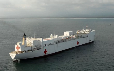 Aerial view of USNS Comfort (T-AH-20), US naval hospital ship with red crosses on deck at sea — HD PC desktop wallpaper background