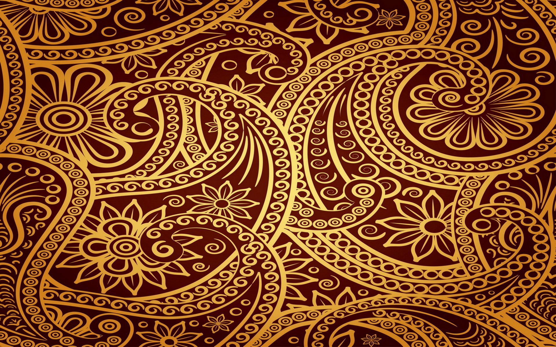 Abstract ornamental gold paisley and floral swirls on deep maroon — 2K Quad HD PC desktop wallpaper/background.