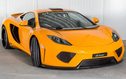 Orange McLaren MP4-12C sports car in a studio, high-resolution HD PC desktop wallpaper/background.