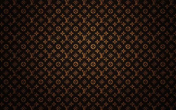 A rich, HD desktop wallpaper featuring a sophisticated Louis Vuitton pattern against a dark background, showcasing elegant man-made design elements.