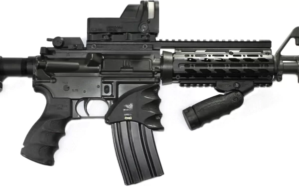 High-definition desktop wallpaper featuring a detailed close-up of a man-made Colt AR-15 rifle with tactical attachments.