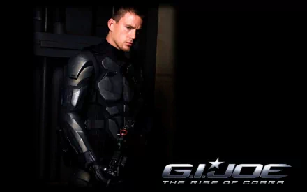 HD PC desktop wallpaper showing a Cobra operative from the G.I. Joe movie G.I. Joe: The Rise of Cobra in black armored suit beside the G.I. Joe logo on a dark background.