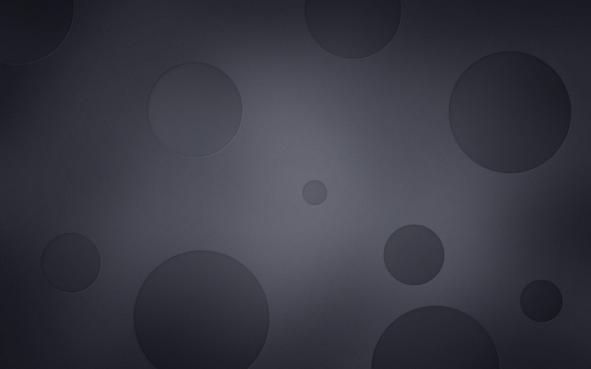 HD PC desktop wallpaper featuring an abstract black design with varying shades of dark circles creating depth and texture.