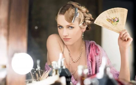 HD PC desktop wallpaper featuring celebrity Naomi Watts in a vintage-inspired look, holding a decorative fan with styled hair and soft makeup.