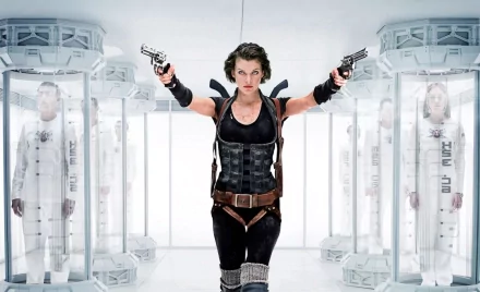 HD wallpaper featuring Milla Jovovich as Alice from Resident Evil: Afterlife. Alice, armed with two pistols, stands poised in a futuristic lab setting, exemplifying the intense action of the movie.