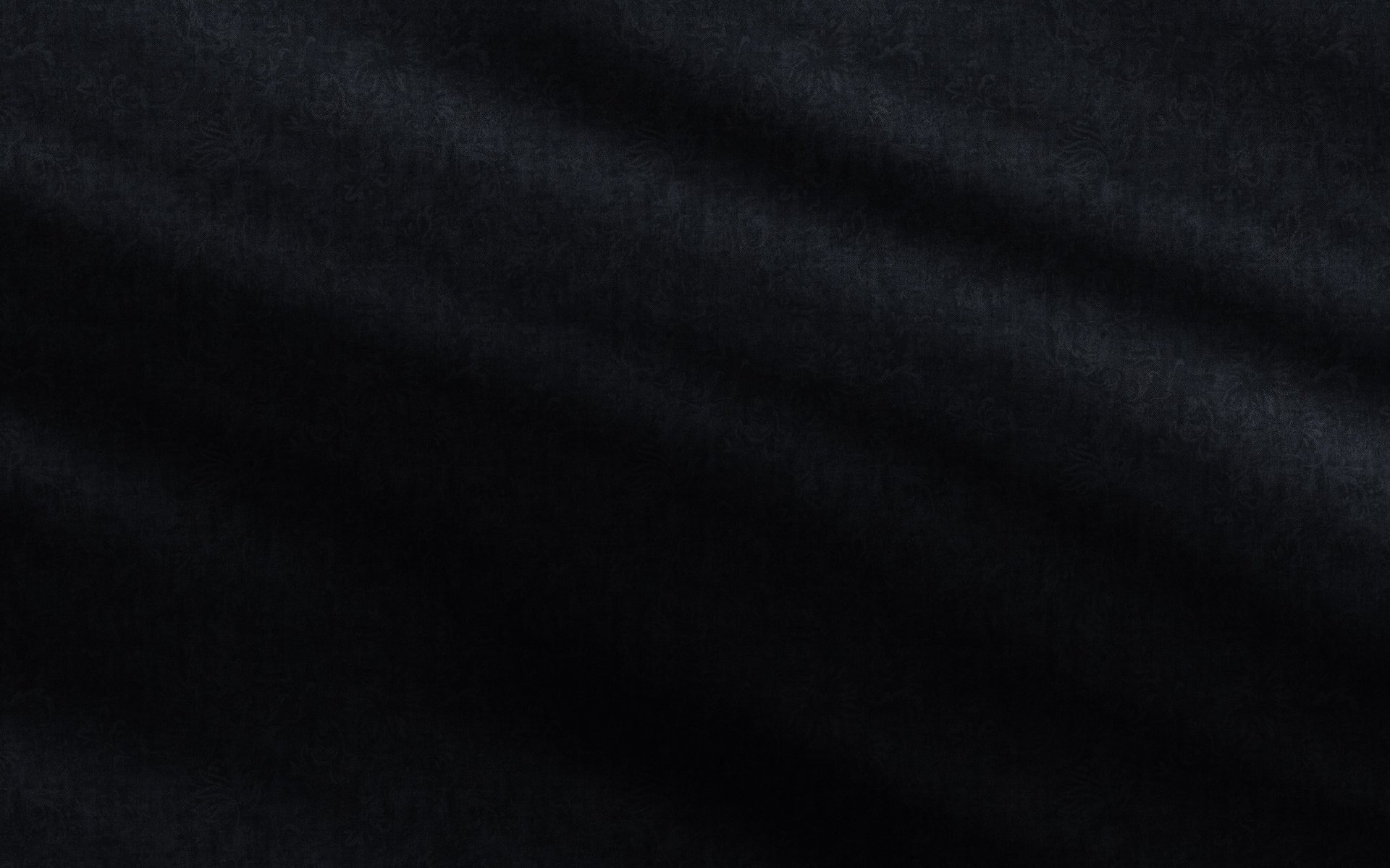 A smooth, abstract black texture, creating a sleek and modern aesthetic. This high-definition image serves as a striking desktop wallpaper and background.
