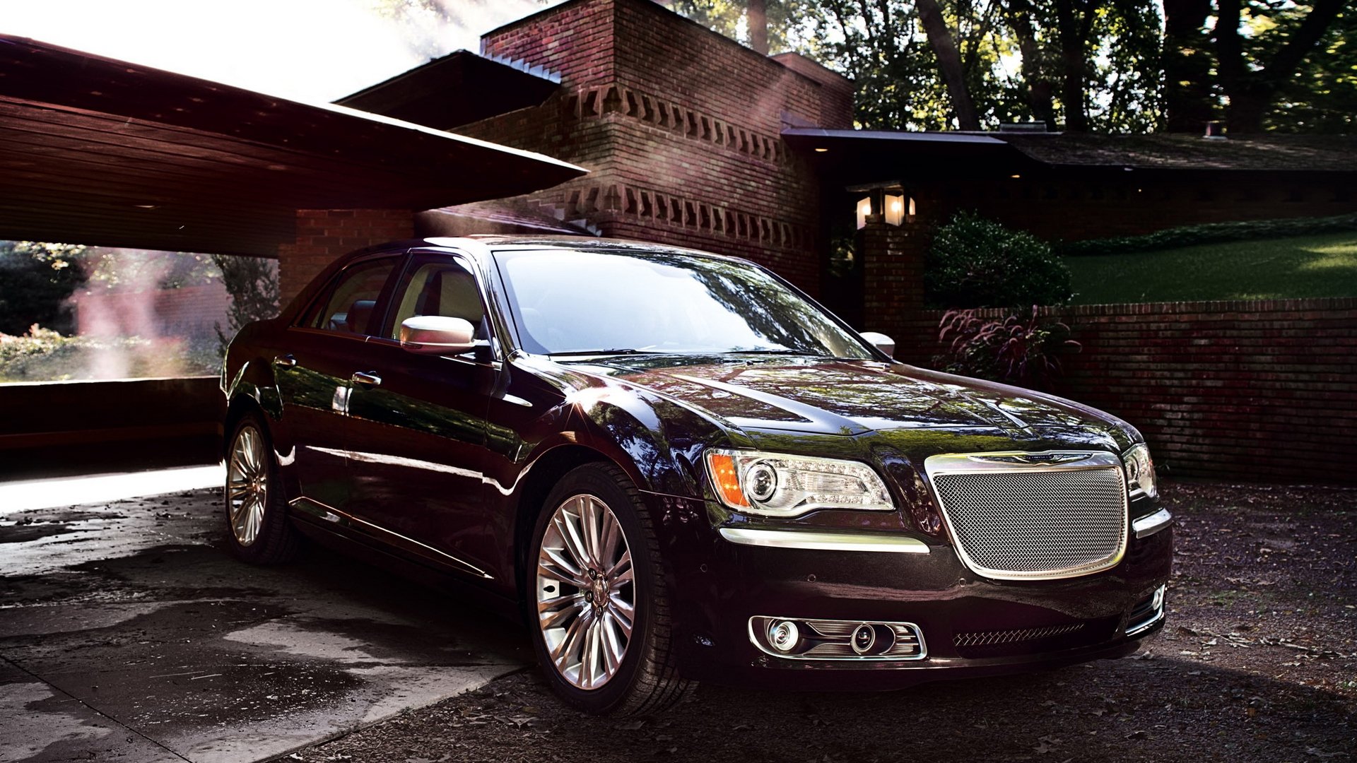 A sleek black Chrysler 300 parked in front of a modern house, captured in high definition for a PC desktop wallpaper and background.