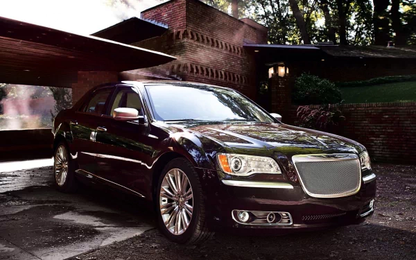 A sleek black Chrysler 300 parked in front of a modern house, captured in high definition for a PC desktop wallpaper and background.