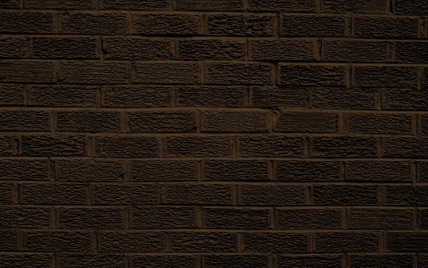 HD photography of a dark brick wall texture, designed as a PC desktop wallpaper and background.