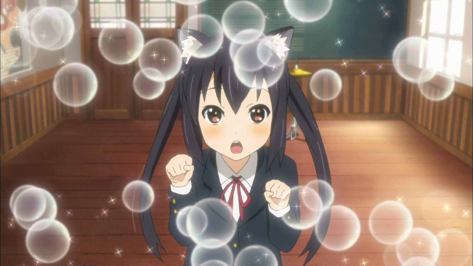 A cheerful character from the anime K-ON! surrounded by floating bubbles, capturing a playful moment. This HD wallpaper adds a lively touch to any desktop background.