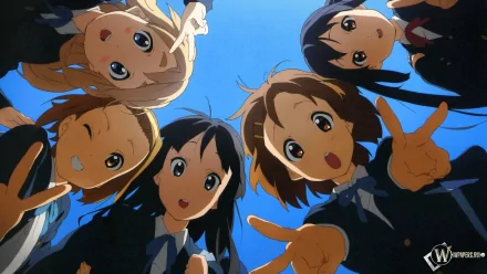 A vibrant HD desktop wallpaper featuring the characters Ritsu Tainaka, Mio Akiyama, Tsumugi Kotobuki, Yui Hirasawa, and Azusa Nakano from the anime K-ON!, joyfully posing together.