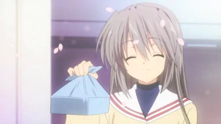 Tomoyo Sakagami from Clannad holding a wrapped lunch with cherry blossom petals falling, featured in a vibrant HD anime desktop wallpaper.