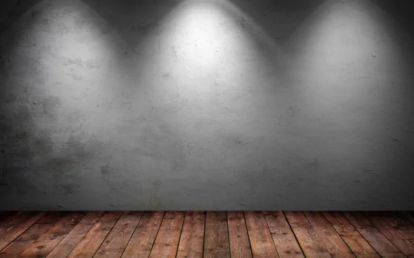 Artistic 4K Ultra HD PC desktop wallpaper showcasing a textured concrete wall illuminated by spotlights above a rustic wooden floor.